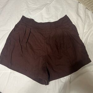 Brown linen shorts worn for vacation